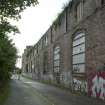 General view of graffiti wall on southside of Dunnikeir works from east.