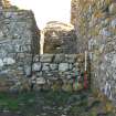 Historic building survey, McVicar Chapel, exterior, W-facing gable wall and blocking work adjacent to the Church wall, Teampull na Trionaid, Cairinis, North Uist, Western Isles