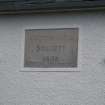 Detail of datestone reading 'Cotton Mill Society 1805' on wall between Nos 2 and 3 John Street, Rothesay, Bute.