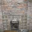 Interior view showing detail of exposed brickwork and fireplace in 21 Queen Anne Street, Dunfermline.