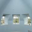 Interior.  Attic.  Bedroom.  View of turret windows.