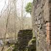 View from south east, detail of ruinious lade supports. The lade would have been positioned ontop of these and would have carried water from the lade to the top of the water wheel. 