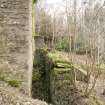 View from north west of water wheel pit. Lade supports in the background.