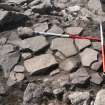 Lower layer of paving slabs overlying passage fill