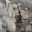Fallen slab: overburden removed to reveal cut of passage