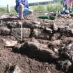 Wall emerges at west end near convergence with outer wall