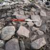 Intramural passage: upper layer of rough paving over fill over stairs