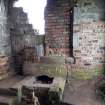View of WSW end of interior of the pump-house, showing the bricked-up opening.