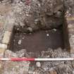 Archaeological evaluation, Floor surface of fire brick channel in trench 49, Cathcart Road, Glasgow