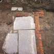 Archaeological evaluation, View of paving [109] and brick wall [108] in trench 1, Cathcart Road, Glasgow