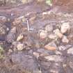 Trial trench evaluation, Putative kerb 1301 surrounding the SW and NE edge of cairn 2, Kilmelford, Argyll