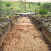 Archaeological evaluation, S end of Trench 1 with rising ground to Roman Camp beyond, Westermains, Kirkintilloch