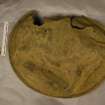 Post excavation, Copper alloy bowl/plate (SF13) reverse pre-conservation, Cousland Castle, Midlothian