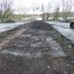 Watching brief, Central reservation stripped to 0.45 m lower than tarmac surface, showing land drain [015], Carpark, St Ninian's Way, Linlithgow