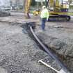 Watching brief, Excavation of drainage/sewer run in centre of central reservation, Carpark, St Ninian's Way, Linlithgow