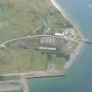 Aerial view of Nigg Pier, WW1 Mine Depot and Dunskeath House, Cromarty Firth, looking SE.