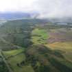 General aerial view  of Tollie, Brahan Wood and Loch Ussie , Black Isle, looking SW.