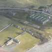 An almost oblique aerial view of the wartime buildings at Nigg ferry, Cromarty Firth, looking NE.