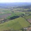 Aerial view of the SW part of Muir of Ord, and the base of the Black Isle, looking S.