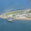 Oblique closer aerial view of Cromarty, the former hemp works and its harbour, looking NE.