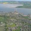 Oblique aerial view of Invergordon with the Cromarty Firth, Harbour and Balblair on the Black Isle, looking S.