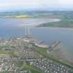 Oblique aerial view of Invergordon with the Cromarty Firth, Harbour and Balblair on the Black Isle, looking S.