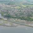 An oblique aerial view of the N end of the Caledonian canal where it enters the Beauly Firth, with Inverness in the background, looking S.