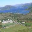 An oblique aerial view of Plockton High School, Plockton and Loch Carrom, Wester Ross, looking NE.