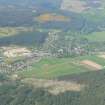 A distant oblique aerial view of Strathpeffer, Easter Ross, looking NE.