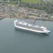 Oblique aerial view of a cruise ship at East pier, Invergordon, Cromarty Firth, looking N.