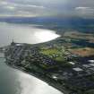 Oblique aerial view of Invergordon on the north side of the Cromarty Firth, looking W.