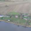 Oblique aerial view of Killearnan Church at Redcastle on the north shore of the Beauly Firth, looking N.