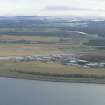 Oblique aerial view of Inverness Airport, looking SE.