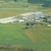 Aerial view of Dalcross Industrial estate and airport, E of Inverness, looking E.