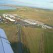 An oblique aerial view of Inverness Airport, Dalcross, Inverness, looking NE.