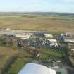 An oblique aerial view of Inverness Airport, Dalcross, Inverness, looking SE.