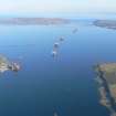 Aerial view of Invergordon, harbour, oil tanks and oil rigs, near Dingwall, Easter Ross, looking E.