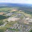 Aerial view of development of Milton of Leys Square and Milton of Leys Primary School, Inverness, looking SSE.