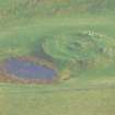 Aerial view of Proncy Castle (mediaeval motte), Dornoch, East Sutherland, looking NE.