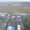 Aerial view of Dalcross Industrial Estate and Inverness Airport, looking ESE.