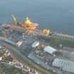 Aerial view of Invergordon harbour and industrial estate, Cromarty Firth, looking SE.