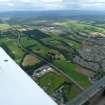 Aerial view of Inshes, Simpsons Garden Centre and A9, on outskirts of Inverness, looking S.
