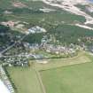 Oblique aerial view of the Findhorn Foundation and dunes beyond, Moray, looking NW.