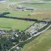 Oblique aerial view of the Findhorn Foundation, Cullerne and part of Kinloss Airfield, Moray, looking E.