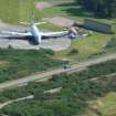 Close-up aerial view of Nimrod marine patrol aircraft at Kinloss Airfield, Moray, looking E.