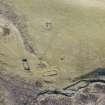 An oblique aerial view of part of the main settlement of Urchany, near Kilmorack, looking SE.