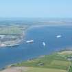 Oblique aerial view from the Black Isle across the Cromarty Firth to Invergordon & Nigg Bay, looking NE.