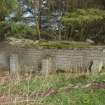 Brick supports for a timber floor in a barrack block at the ENE end of a barracks adjacent to a washroom wall