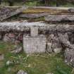 A foundation support for a timber post on the SSE side of the NNW section of the building