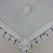 Evaluation Photograph, Room 4- view of west corner showing cornice and decorative statue with plaster boss above, facing W, Old Coates House